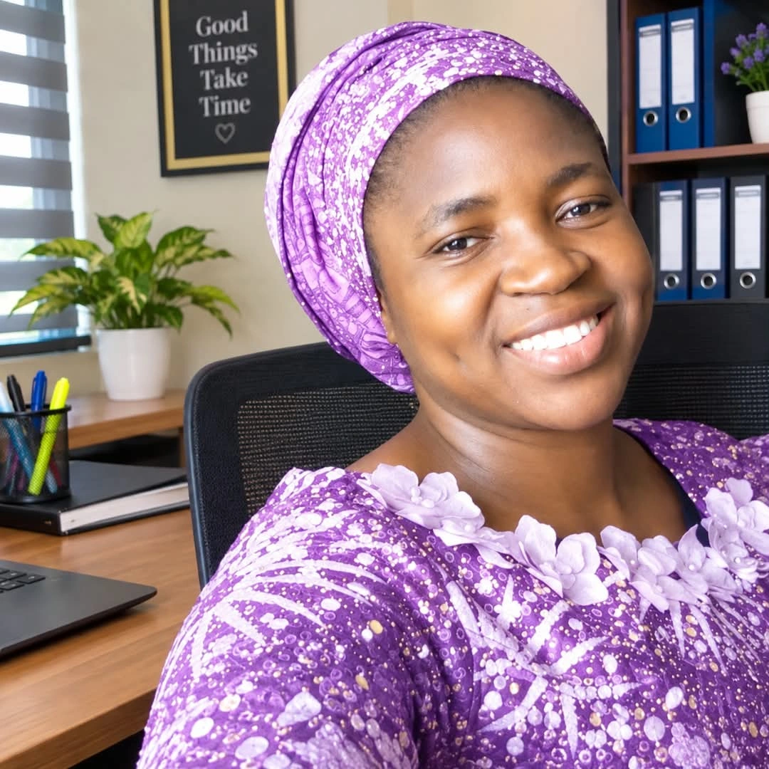 Mrs Adebayo, Head Teacher of Living Spring Nursery and Primary School, wearing purple