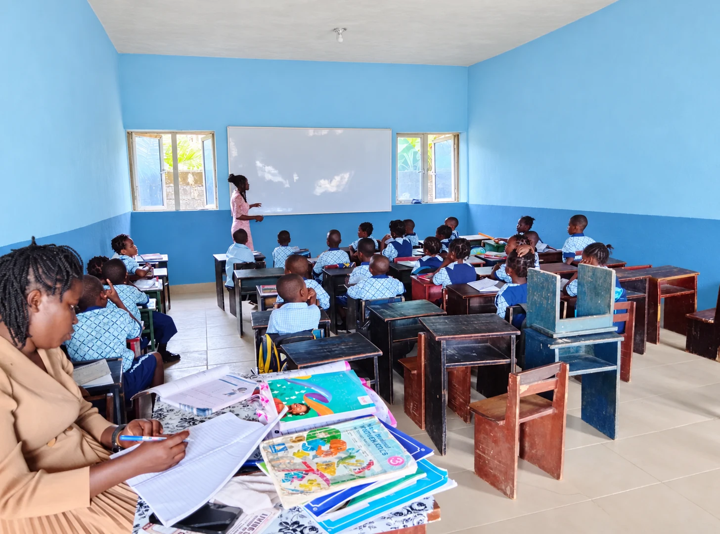 Primary pupils following a teacher-led classroom lesson
