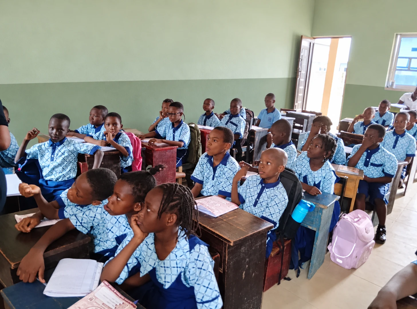 Primary pupils seated together during a lesson