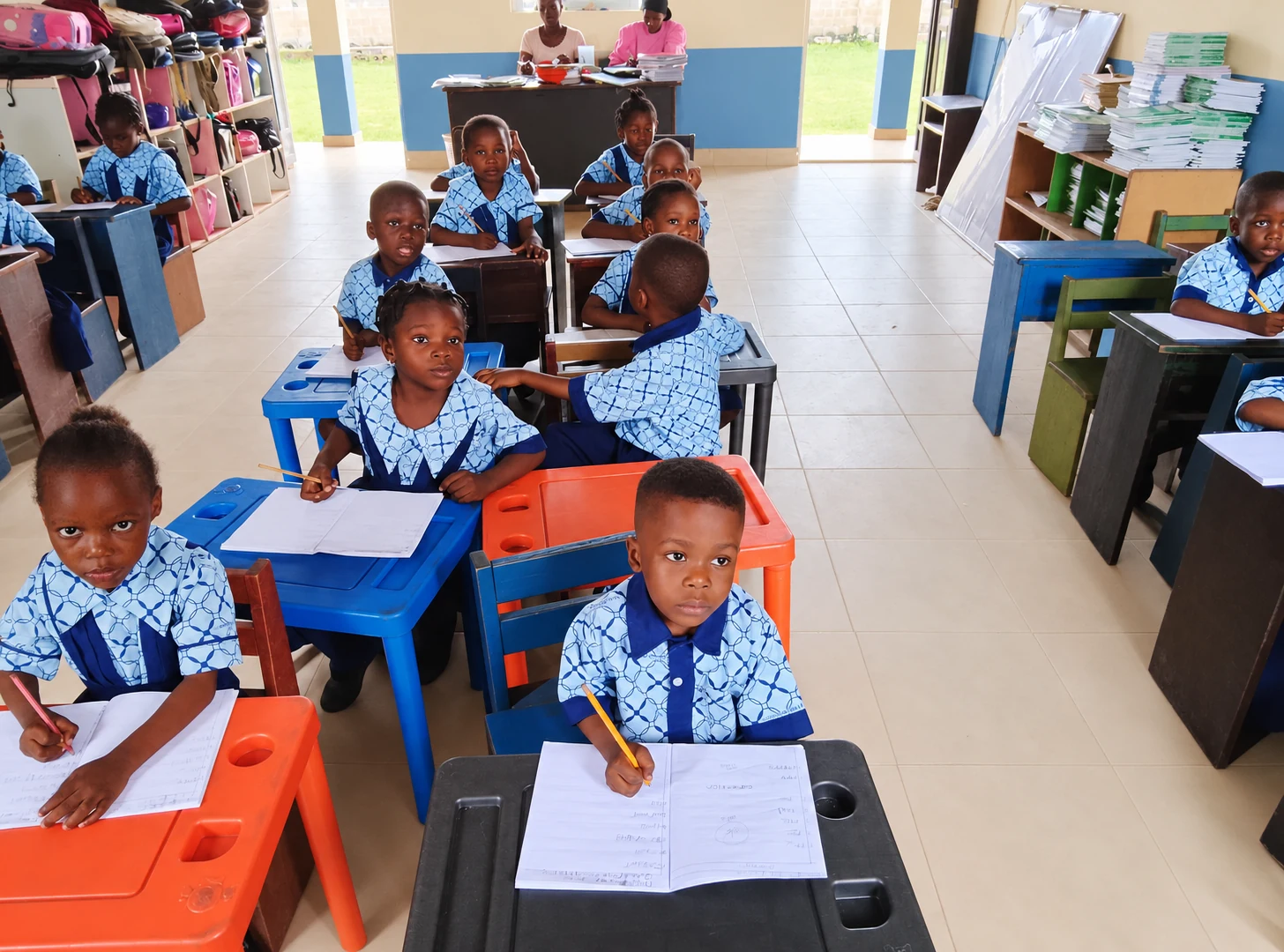Primary pupils working with pencils and exercise books